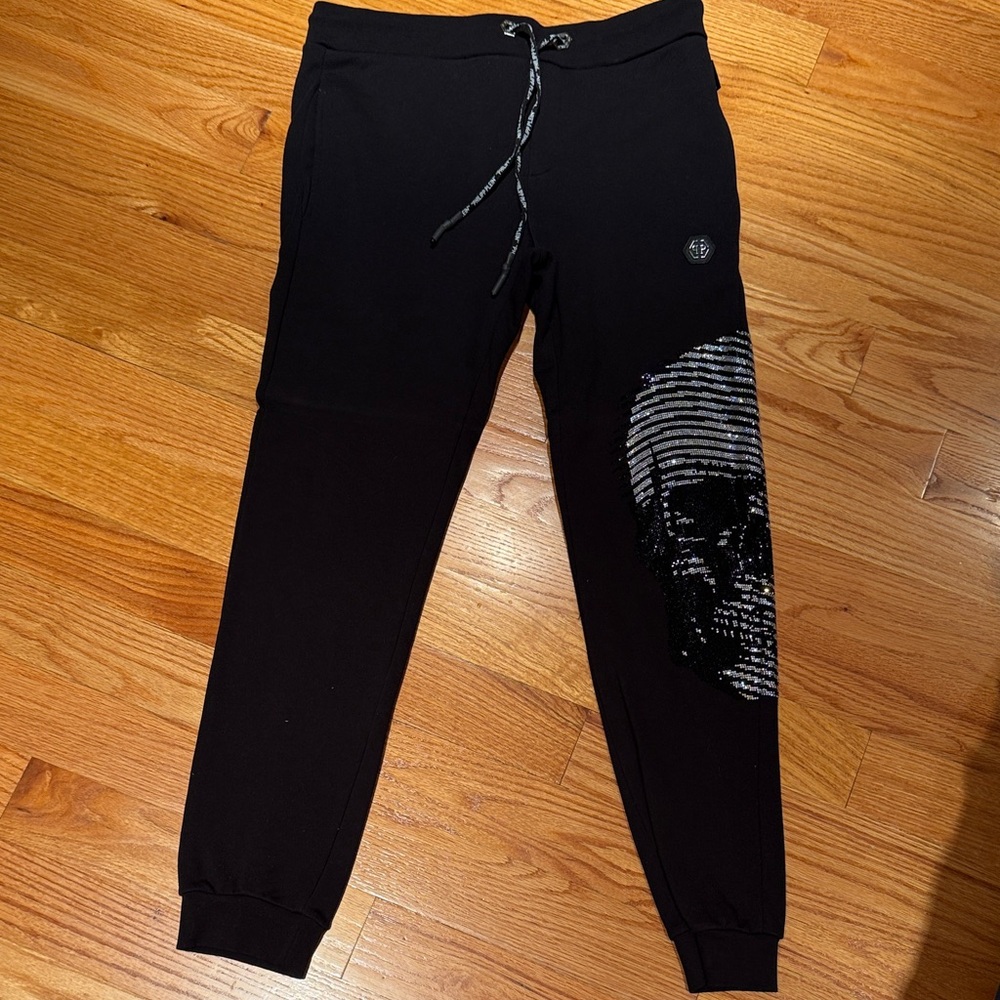 Black Skull Design in Chrystals Men's Joggers by PHILLIP PLEIN